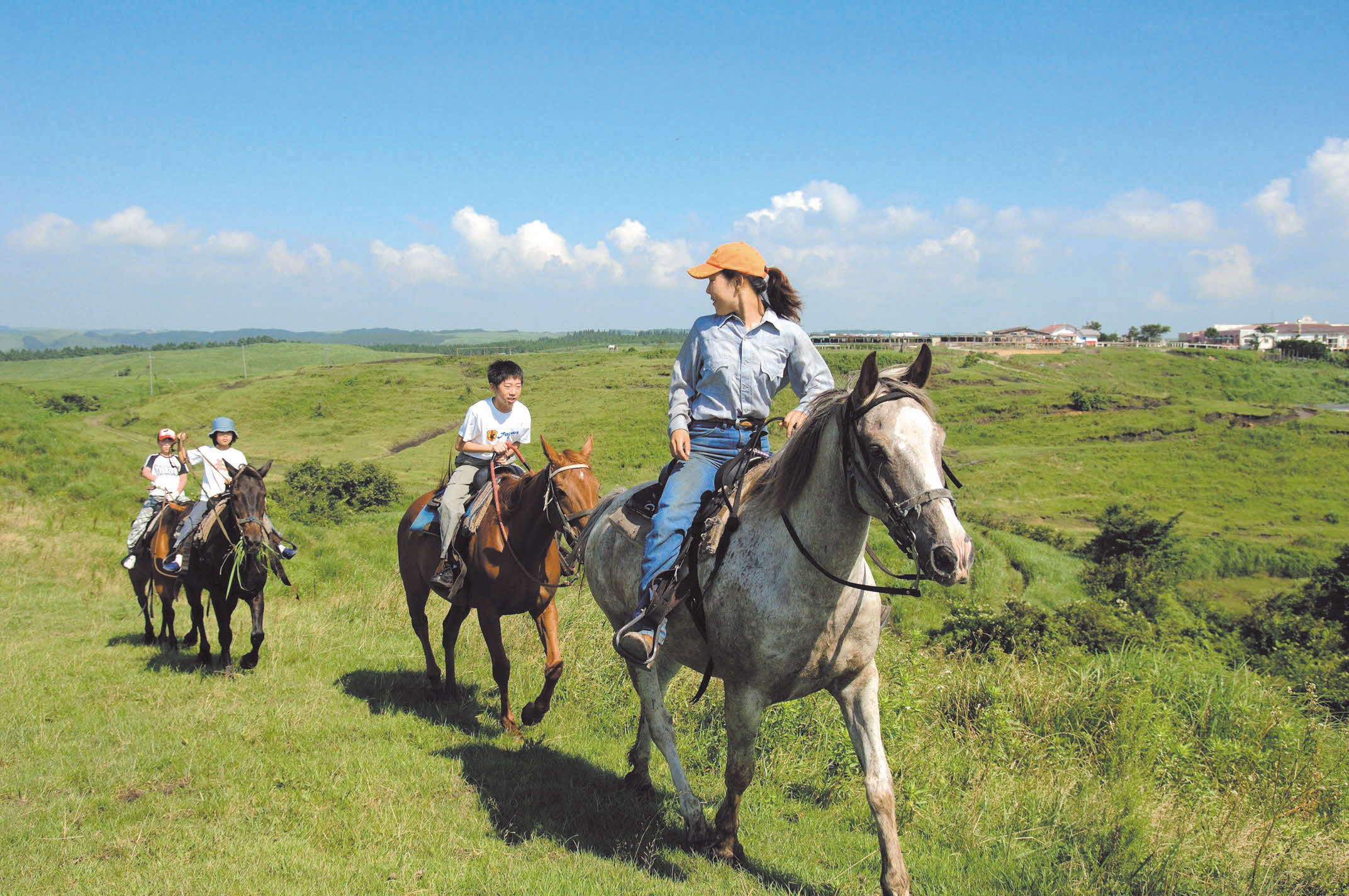 Horseback riding through Aso grasslands